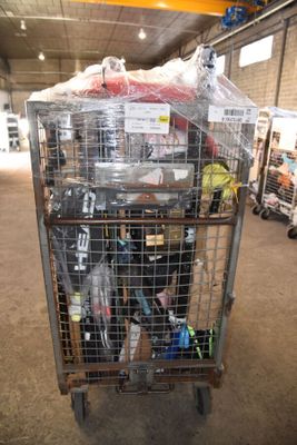 a cart with many items inside of it in a warehouse