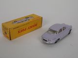 a small toy car sitting next to a box on a table