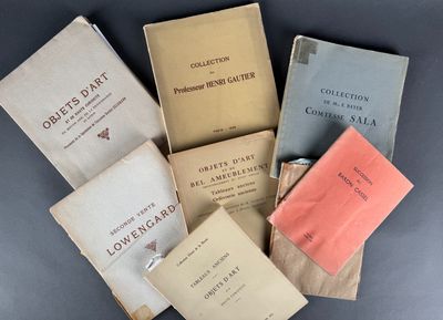 several books sitting on top of each other on top of a table