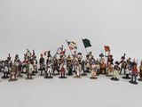 many figurines of soldiers with flags on them