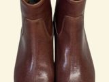 pair of brown leather boots on a white background