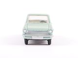 a small toy car that is sitting on a white surface