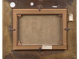an old picture frame with a picture hanging on a wall