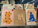many cards that are on a shelf in a store