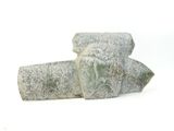 two pieces of stone sitting on top of each other