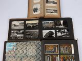 an open book sitting on top of a white table covered in pictures
