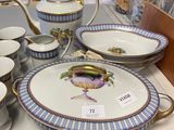 a lot of plates and cups on the table