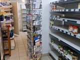 many shelves in the store that have various items on them
