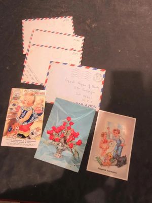 many postcards and envelopes on the table