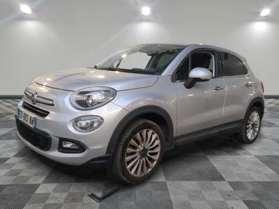 the silver fiat suv is parked on a checkered tile floor