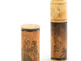 pair of small wooden containers with a picture of a man and a woman on them