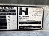 a sign on the side of a building that says hubbere