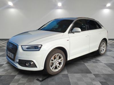 the white audi suv is parked on a checkered tile floor