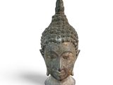 une image représentant une statue représentant une tête de Bouddha sur fond blanc