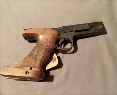 a gun that is on a table with a tag on it