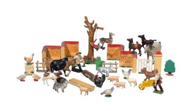 a lot of toy animals that are on a white surface
