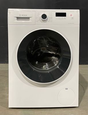 the front view of a white washing machine sitting on a counter