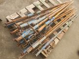 a pile of old rusty metal pipes on a pallet