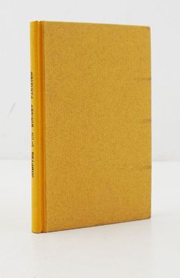 a yellow book sitting on top of a white table