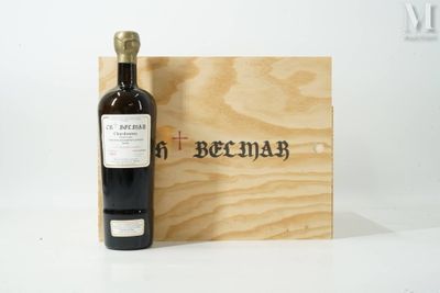 a bottle of wine sitting next to a wooden box