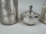 a silver container with a lid and a silver container with a lid