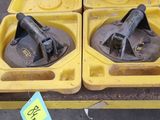 two yellow trays that are sitting on a table