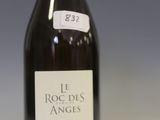 a bottle of wine sitting on a table with a label on it