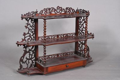 a wooden shelf with a drawer underneath it