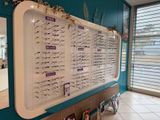 a large display of glasses on the wall in the room
