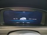 a picture of a car ' s dashboard with a digital display