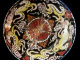 a colorful bowl with a clock in the middle of it