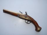 an old gun that is on display on a table