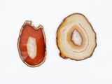 two pieces of agate on a white surface