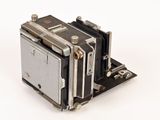 an old camera sitting on top of a white surface