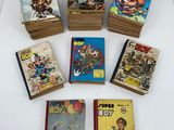 several books are stacked on top of each other on a table