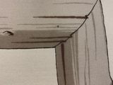 someone is drawing a picture of a green plant in a box