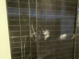 two panels of glass that have been broken off