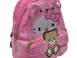 a hello kitty backpack with a teddy bear on it