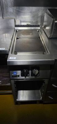 a kitchen with a stove and a microwave in it