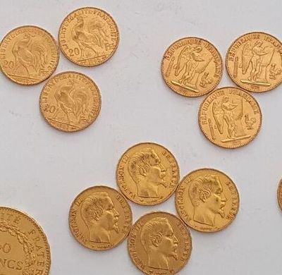 a lot of gold coins sitting on a white surface