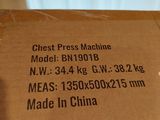 a brown box with a label on it that says chest press machine
