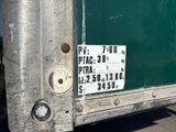 a sign on the back of a green truck