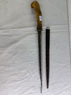 a knife and a pair of scissors on a table