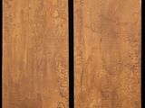 two pieces of wood are shown against a black background
