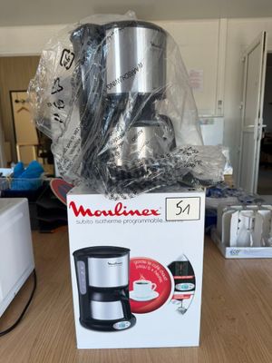 a box with a coffee maker on it on a table