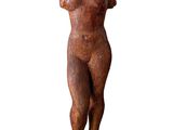 statue of a woman standing on a stone base with her hands on her hips