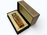 an open box with a watch inside of it on a white surface