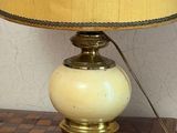 a lamp that is on top of a wooden table