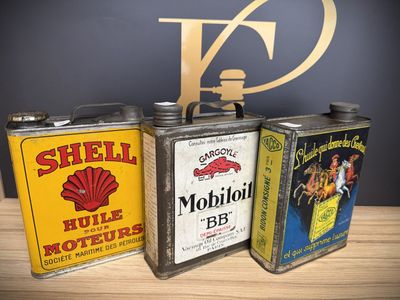 three tins that are sitting on a table