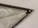 a pair of scissors sitting on top of a piece of metal
